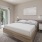 large bedroom with private balcony access
