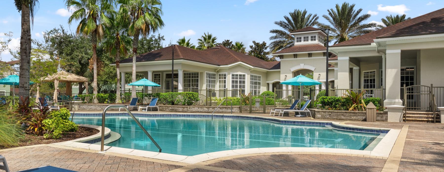 swimming pool with lounge chairs