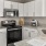 a kitchen with white cabinets